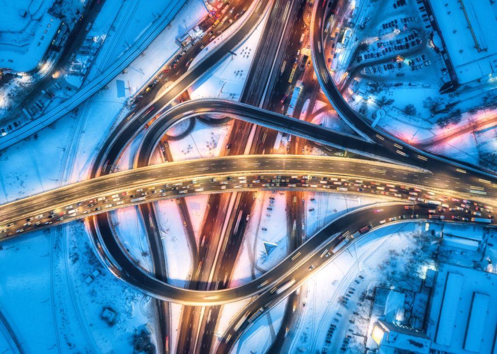 Aerial view of a roadway during the winter.