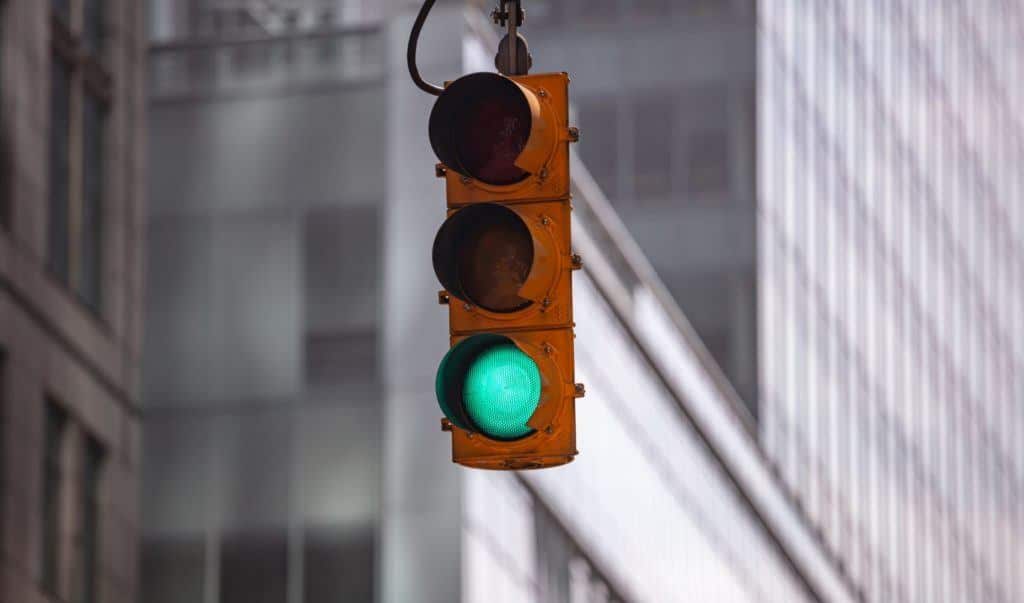 Traffic light turning green. Some proponents in the ADAS community believe connected infrastructure will play a role in creating safe roads.