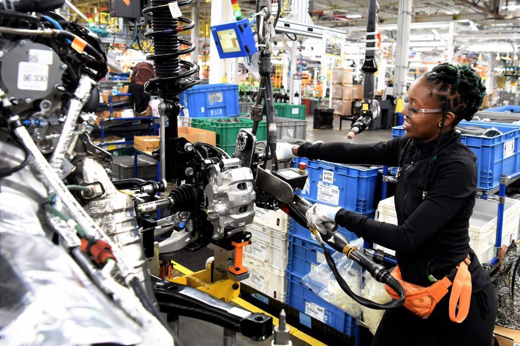 Ford employee Ebony Atkins-Conner installs mechanical components on the 2020 Ford Explorer at the Chicago Assembly Plant.