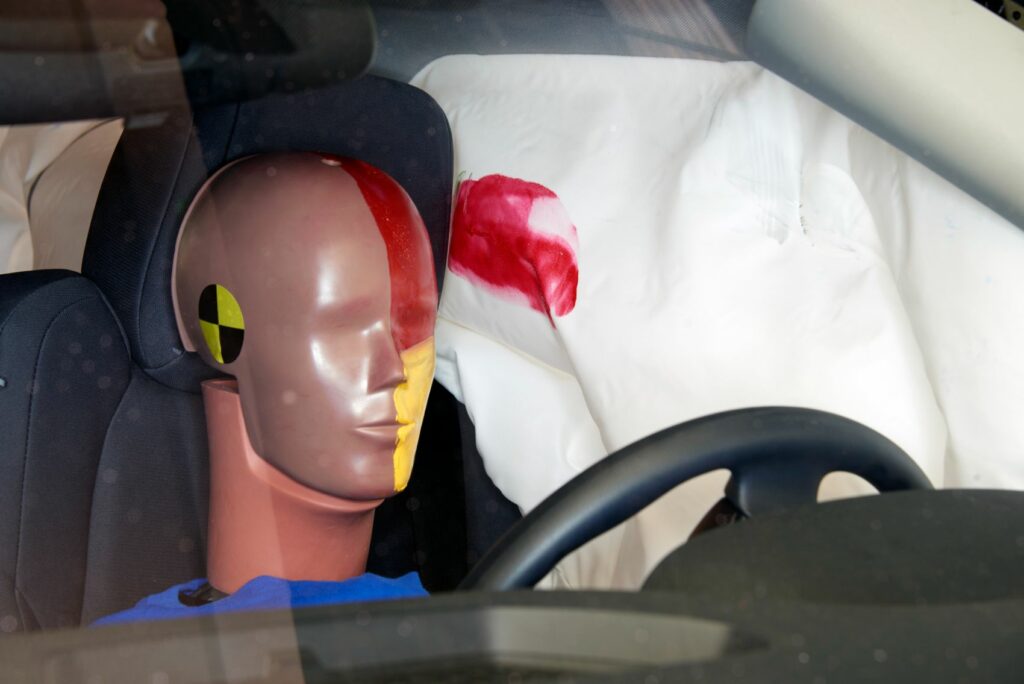 Smeared paint shows where the dummy's head was protected from hard structures by the side airbags. Photo: IIHS, 2022 Nissan Frontier crew cab side test. 
